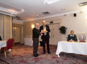 Paddy Divilly, joint first winner of the Majors section, receiving his prize from Galway Chess Club treasurer Andrew.